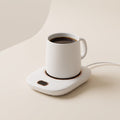 White Warm Regards mug warmer with a white coffee mug on a clean cream background
